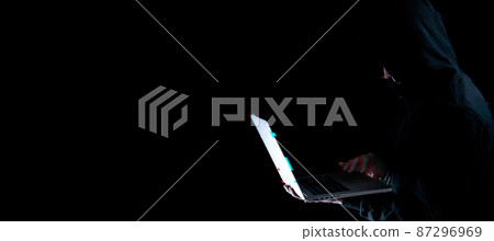 Hacker attack cyber security. Digital laptop in hacker man hand isolated on black. Blurred Internet web hack technology with glitch effect. Login and password, cybersecurity banner concept. Hacker attack cyber security. Digital laptop in hacker man hand isolated on black. Blurred Internet web hack technology with glitch effect. Login and password, cybersecurity banner concept. 87296969