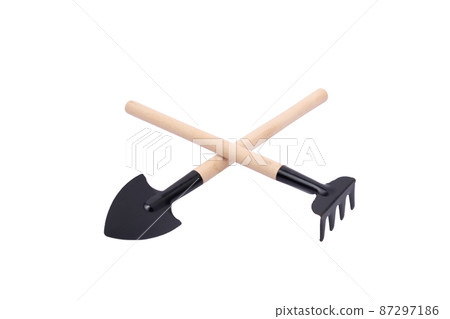 Garden trowel and rake in isolated with clipping path. .gardening equipment. 87297186
