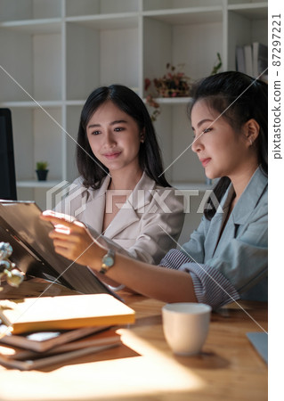 Group of Businesswoman and Accountant checking data document on digital tablet for investigation of corruption account . Anti Bribery concept. Group of Businesswoman and Accountant checking data document on digital tablet for investigation of corruption account . Anti Bribery concept. 87297221