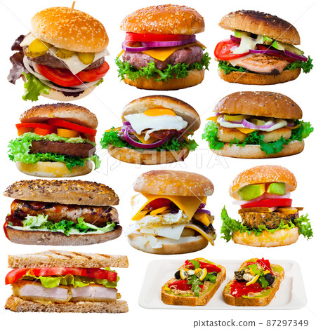 Assorted hamburgers, sandwiches and toasts isolated on white Assorted hamburgers, sandwiches and toasts isolated on white 87297349
