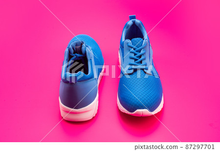 pair of comfortable blue sport shoes on pink background, sneakers pair of comfortable blue sport shoes on pink background, sneakers 87297701