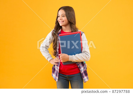 Education comes first. Happy child hold study books. Basic education. Back to school. Education comes first. Happy child hold study books. Basic education. Back to school. 87297788