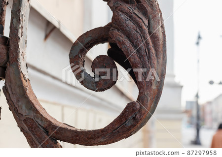 Forged rusty decoration, exterior details of an old house Forged rusty decoration, exterior details of an old house 87297958