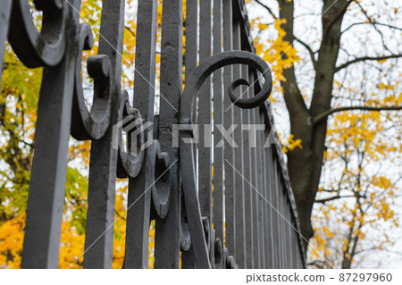 Black forged metal fence details, close up photo Black forged metal fence details, close up photo 87297960