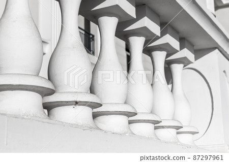White balcony balusters. Classical architecture White balcony balusters. Classical architecture 87297961