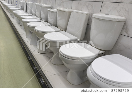 Sale of toilet bowls of different models in the plumbing store Sale of toilet bowls of different models in the plumbing store 87298739