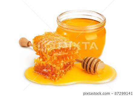 Honeycombs and honey puddle isolated on white background with clipping path and full depth of field 87299141