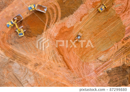 Heavy tractor machinery excavator align the earth doing landscaping 87299880