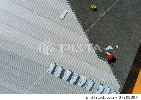 Roof installing asphalt shingles with new shingles of an building 87299887