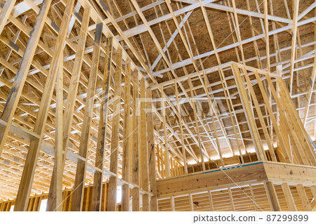 New house under construction wood framing beams stick New house under construction wood framing beams stick 87299899