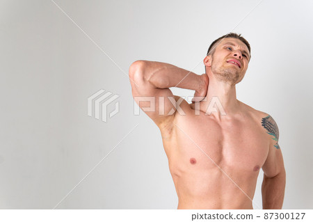 The muscles of the neck in a man on a white background are hurt pain body cramp person isolated health medical, chronic. lumbar therapy, problem suffer attractive The muscles of the neck in a man on a white background are hurt pain body cramp person isolated health medical, chronic. lumbar therapy, problem suffer attractive 87300127