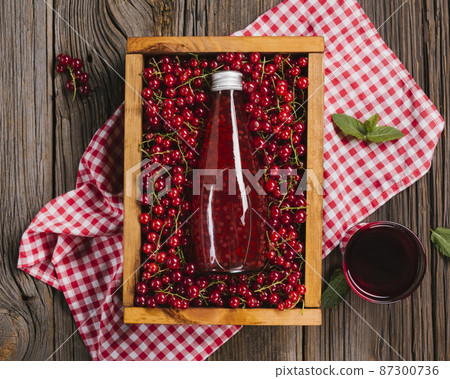 cranberry juice bottle wooden background 87300736