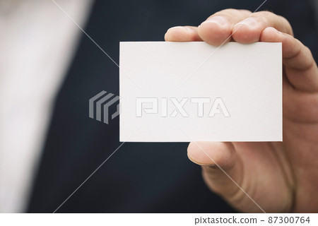 close up visiting card hand close up visiting card hand 87300764