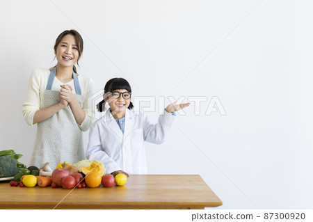 Girl in a lab coat and a housewife 87300920