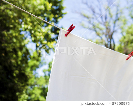 close up white sheet drying line close up white sheet drying line 87300975