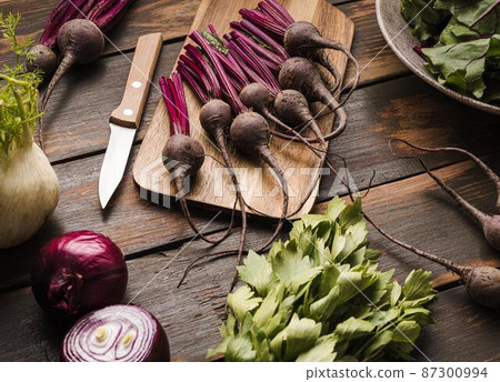 fresh beet cutting board flat lay 87300994