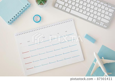 flat lay planner calendar with blue accessories 87301411