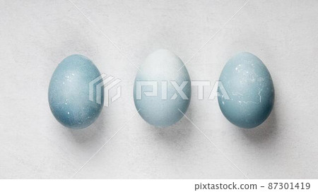 flat lay three easter eggs 87301419