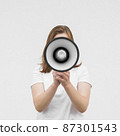 front view girl screaming megaphone 87301543