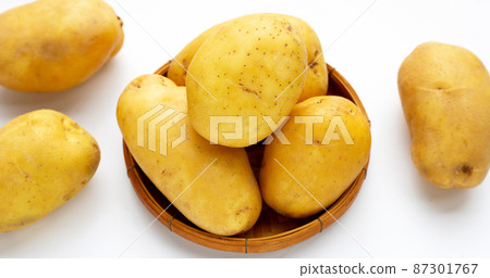 Raw potatoes isolated on white background Raw potatoes isolated on white background 87301767