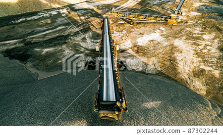 Conveyor belt of fresh crushed stone Conveyor belt of fresh crushed stone 87302244