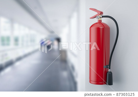Fire extinguishers hanging on wall in office 87303125