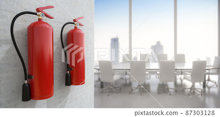 Fire extinguishers hanging on wall in office Fire extinguishers hanging on wall in office 87303128