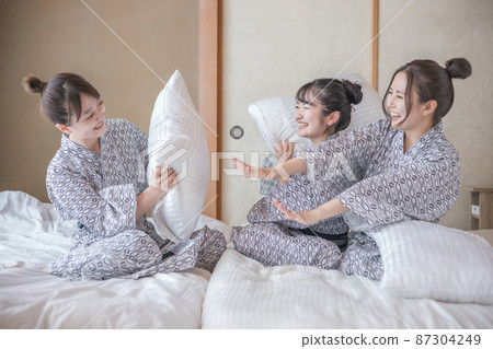 Women traveling and pillowing Women traveling and pillowing 87304249