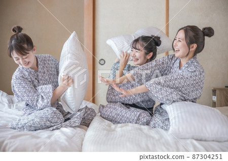 Women traveling and pillowing Women traveling and pillowing 87304251