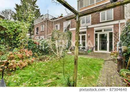 Large house with a garden in the backyard 87304640