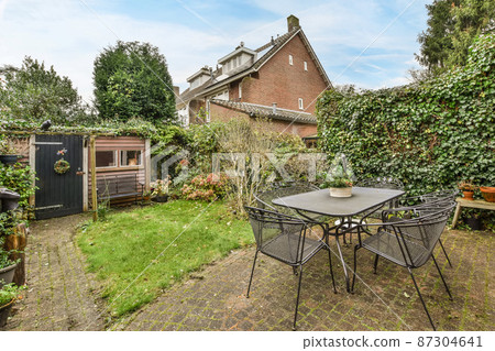 Large house with a garden in the backyard 87304641