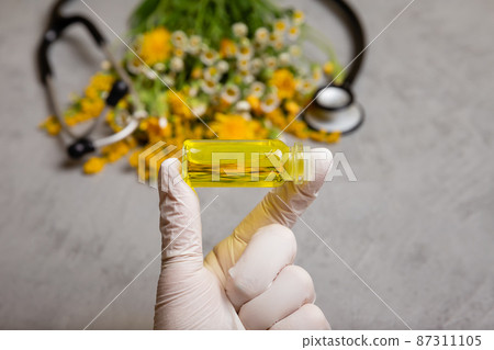 Essential oil or oil for natural diseases treatment in glass bottle. 87311105