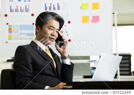 Business men laptops phones smartphones 87312244