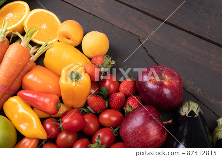 High angle view of various fresh organic fruits and vegetables on table, copy space High angle view of various fresh organic fruits and vegetables on table, copy space 87312815