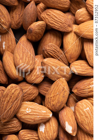 Extreme close-up shot of healthy almonds with copy space 87312952