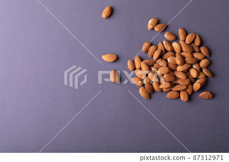 Directly above shot of nutritious almonds on gray background with copy space 87312971
