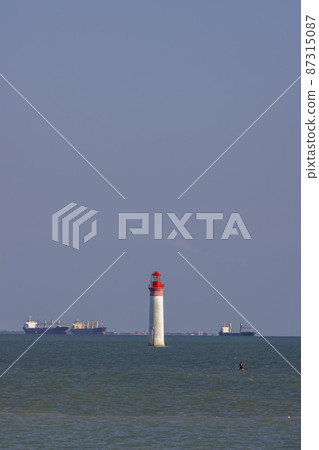 Phare de Chauvea near Ile de Re with ships to La Rochelle, Pays de la Loire, France Phare de Chauvea near Ile de Re with ships to La Rochelle, Pays de la Loire, France 87315087
