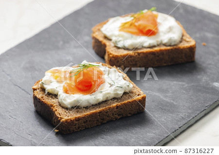 whole grain bread with dill spread and smoked salmon 87316227