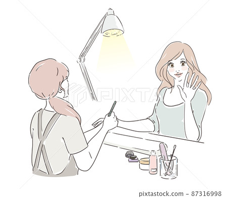 A cute woman undergoing treatment at a nail salon 87316998