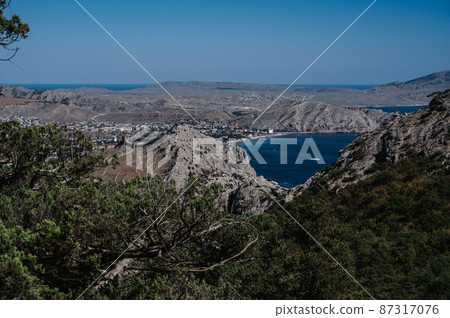 View of the ancient city of Sudak and the Genoese fortress on the Black Sea coast in Crimea View of the ancient city of Sudak and the Genoese fortress on the Black Sea coast in Crimea 87317076