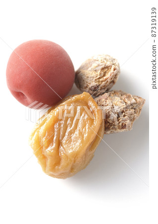 Shooting plums (dried plums) in various states on a white background Shooting plums (dried plums) in various states on a white background 87319139