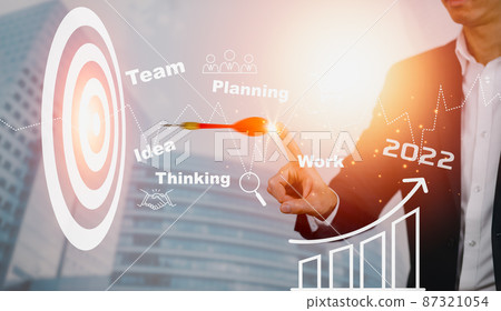 2022 with new Target of business concept,Targeting the business concept, Businessman throwing red arrow dart to virtual target dart board,Executive marketing, investment goal and target for business. 87321054