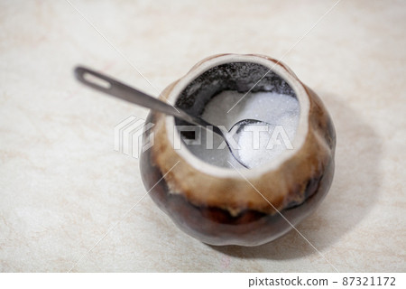 Spoon in a ceramic figured sugar bowl Spoon in a ceramic figured sugar bowl 87321172
