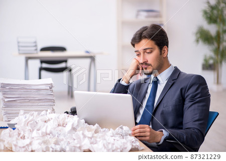 Young male employee in brainstorming concept Young male employee in brainstorming concept 87321229