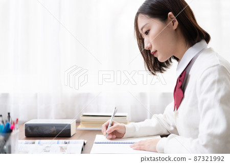 High school girl studying English by the window 87321992