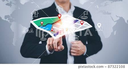 Businessman hand touch virtual world and model map with location point , GPS app, icon Travel maps and find places in the online system, all screen graphics are generated,Searching for travel goals. 87322108