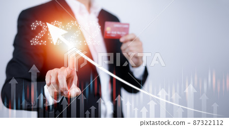 Businessman touch arrow growth data chart arrow with diagram 2022 budget and visa credit card, Businessman pointing arrow graph corporate future growth year 2022, online spending, Shopping online Businessman touch arrow growth data chart arrow with diagram 2022 budget and visa credit card, Businessman pointing arrow graph corporate future growth year 2022, online spending, Shopping online 87322112
