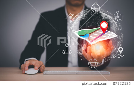 Businessman hand holding virtual world and model map with location point , GPS app, icon Travel maps and find places in the online system, all screen graphics are generated,Searching for travel goals. Businessman hand holding virtual world and model map with location point , GPS app, icon Travel maps and find places in the online system, all screen graphics are generated,Searching for travel goals. 87322125