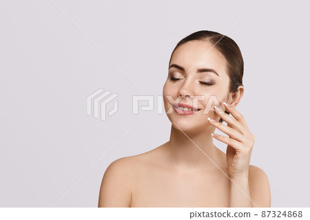 Beautiful woman portrait, skin care concept, beautiful skin. Portrait of female hands with manicure nails. Beautiful woman portrait, skin care concept, beautiful skin. Portrait of female hands with manicure nails. 87324868