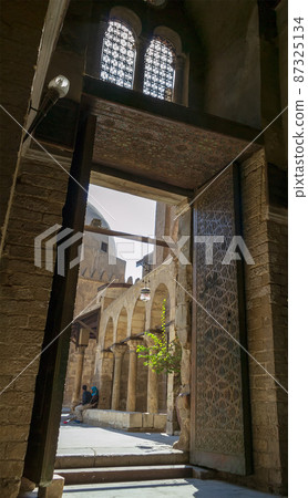 Entrance of Qalawun complex, a massive complex in Cairo, Egypt that includes a madrasa, a hospital and a mausoleum Entrance of Qalawun complex, a massive complex in Cairo, Egypt that includes a madrasa, a hospital and a mausoleum 87325134
